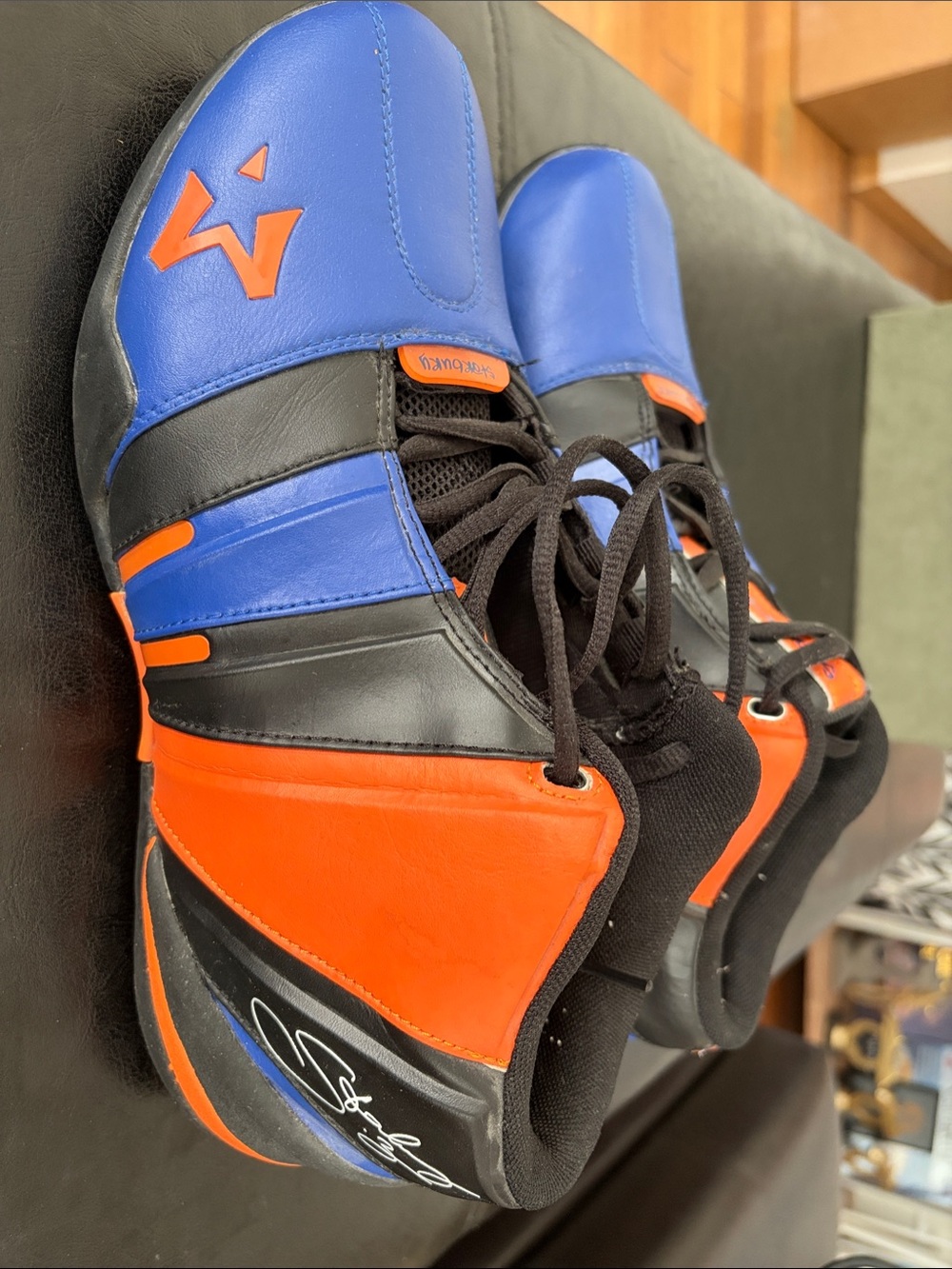 Starbury II basketball shoes in a blue, black, and orange Knicks colorway